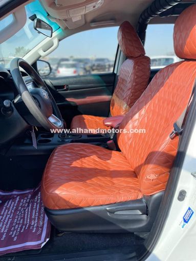 Подержанный Toyota Hilux VIII Рестайлинг, 2.4 л, 2021 в Дубае от Alhamd Motors Белый цвет. GCC | AUTO.AE