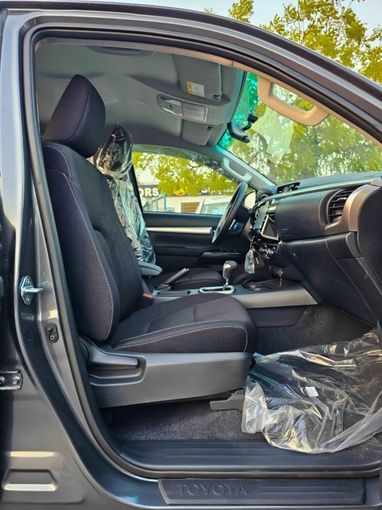 New Toyota Hilux VIII Facelift 2, 2.4 l, 2025 in Dubai by SK Motors, Grey color. GCC Specs | AUTO.AE