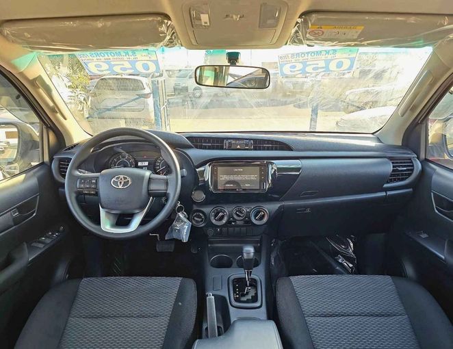 New Toyota Hilux VIII Facelift 2, 2.4 l, 2025 in Dubai by SK Motors, White color. GCC Specs | AUTO.AE