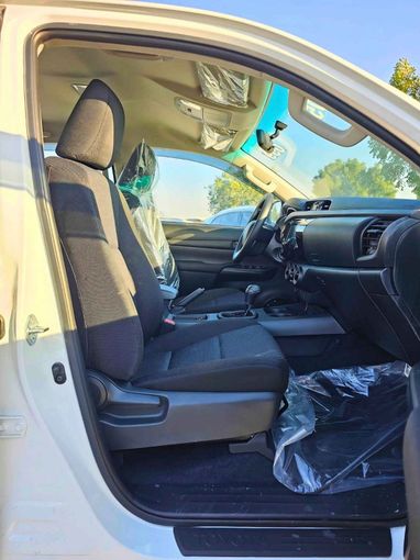 New Toyota Hilux VIII Facelift 2, 2.4 l, 2025 in Dubai by SK Motors, White color. GCC Specs | AUTO.AE