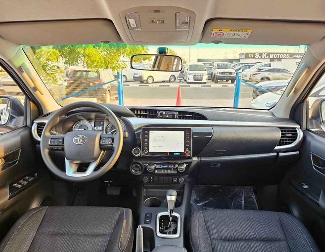 New Toyota Hilux VIII Facelift 2, 2.4 l, 2025 in Dubai by SK Motors, White color. GCC Specs | AUTO.AE
