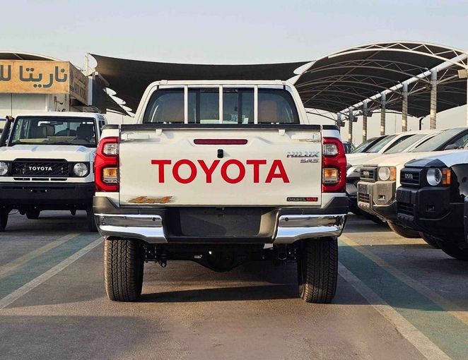 New Toyota Hilux VIII Facelift 2, 2.8 l, 2025 in Dubai by SK Motors, White color. GCC Specs | AUTO.AE
