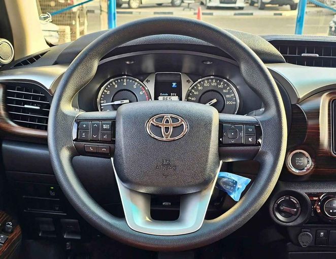 New Toyota Hilux VIII Facelift, 2.7 l, 2025 in Dubai by SK Motors, Black color. GCC Specs | AUTO.AE
