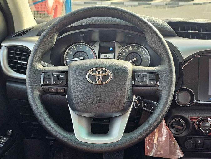 New Toyota Hilux VIII Facelift 2, 2.7 l, 2024 in Dubai by SK Motors, White color. GCC Specs | AUTO.AE