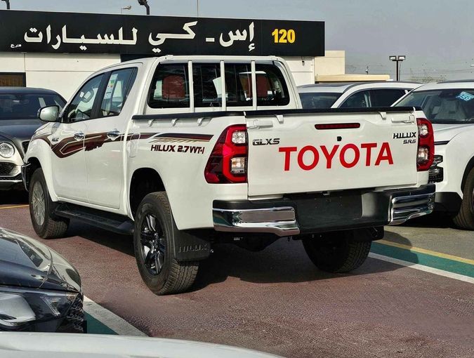 New Toyota Hilux VIII Facelift 2, 2.7 l, 2024 in Dubai by SK Motors, White color. GCC Specs | AUTO.AE