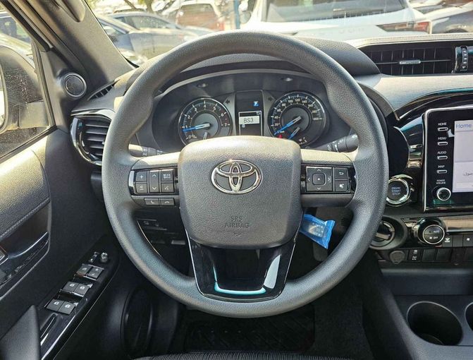 New Toyota Hilux VIII Facelift, 4.0 l, 2024 in Dubai by SK Motors, White color. GCC Specs | AUTO.AE