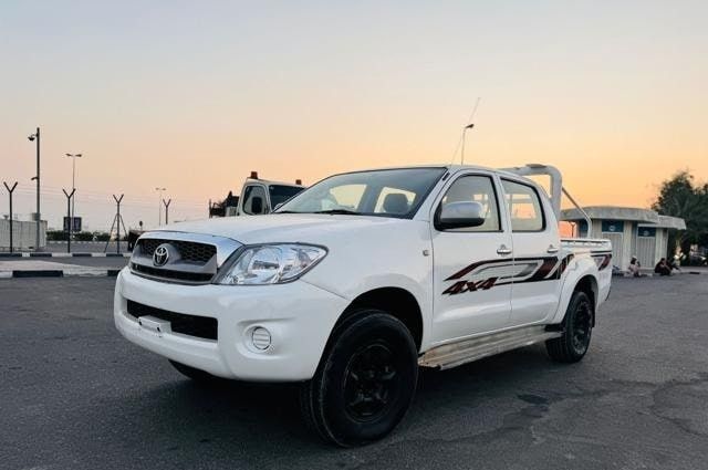 Подержанный Toyota Hilux VII, 2.7 л, 2010 в Дубае от Alhamd Motors Белый цвет. GCC | AUTO.AE
