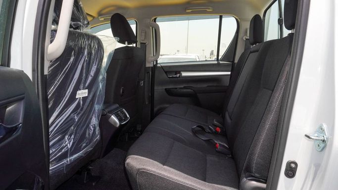 Новый Toyota Hilux VIII Рестайлинг, 2.4 л, 2025 в Дубае от Najem Motors Белый цвет. GCC | AUTO.AE