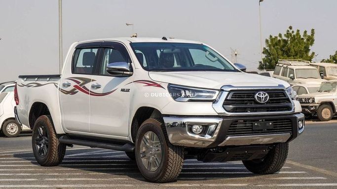New Toyota Hilux VIII Facelift, 2.7 l, 2025 in Dubai by Najem Motors, White color. GCC Specs | AUTO.AE