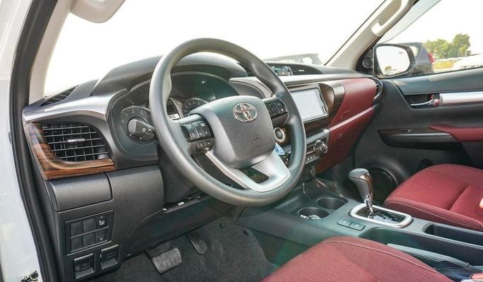 New Toyota Hilux VIII Facelift, 2.7 l, 2025 in Dubai by Najem Motors, White color. GCC Specs | AUTO.AE