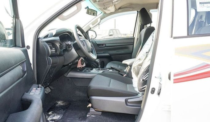 New Toyota Hilux VIII Facelift, 2.4 l, 2025 in Dubai by Najem Motors, White color. GCC Specs | AUTO.AE