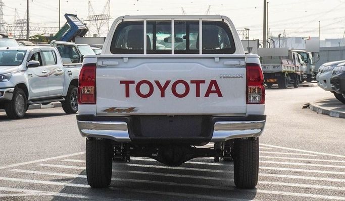 New Toyota Hilux VIII Facelift, 2.4 l, 2025 in Dubai by Najem Motors, White color. GCC Specs | AUTO.AE