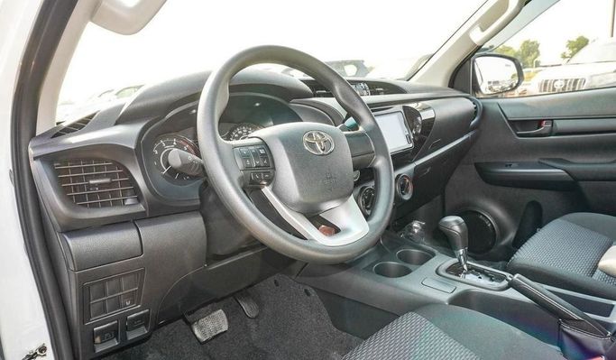 New Toyota Hilux VIII Facelift, 2.4 l, 2025 in Dubai by Najem Motors, White color. GCC Specs | AUTO.AE