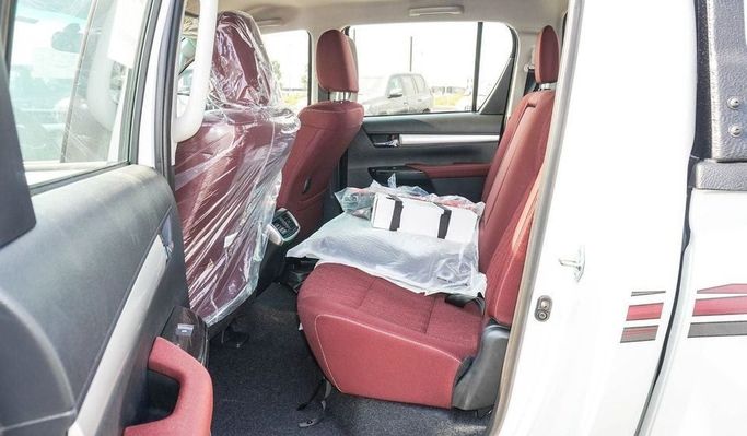 New Toyota Hilux VIII Facelift, 2.7 l, 2024 in Dubai by Najem Motors, White color. GCC Specs | AUTO.AE