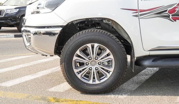 New Toyota Hilux VIII Facelift, 2.7 l, 2024 in Dubai by Najem Motors, White color. GCC Specs | AUTO.AE