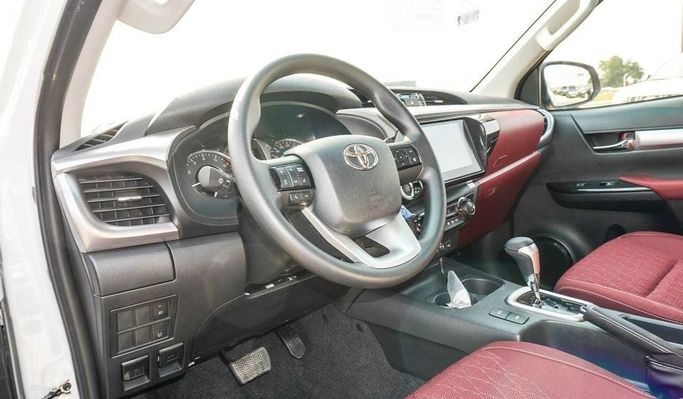 New Toyota Hilux VIII Facelift, 2.7 l, 2024 in Dubai by Najem Motors, White color. GCC Specs | AUTO.AE