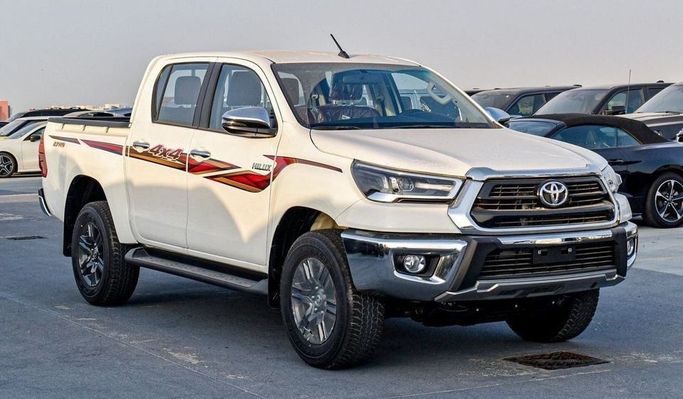 New Toyota Hilux VIII Facelift, 2.7 l, 2025 in Dubai by Najem Motors, White color. GCC Specs | AUTO.AE