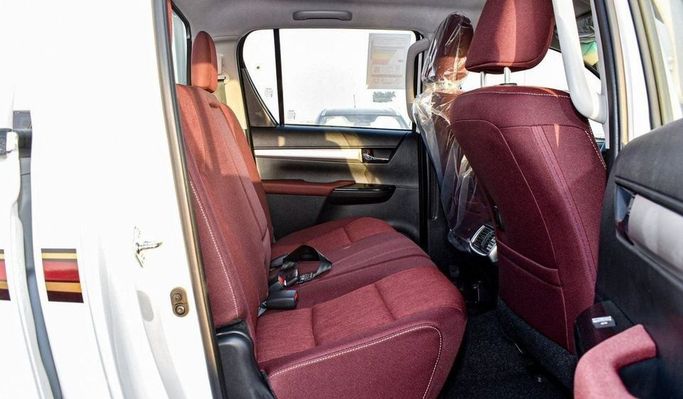 New Toyota Hilux VIII Facelift, 2.7 l, 2025 in Dubai by Najem Motors, White color. GCC Specs | AUTO.AE