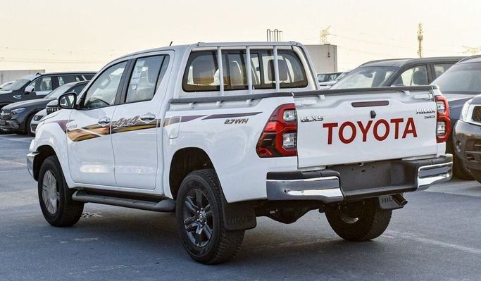 New Toyota Hilux VIII Facelift, 2.7 l, 2025 in Dubai by Najem Motors, White color. GCC Specs | AUTO.AE
