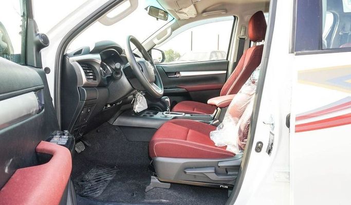 New Toyota Hilux VIII Facelift, 2.4 l, 2025 in Dubai by Najem Motors, White color. GCC Specs | AUTO.AE