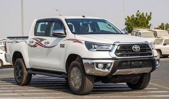 New Toyota Hilux VIII Facelift, 2.4 l, 2025 in Dubai by Najem Motors, White color. GCC Specs | AUTO.AE