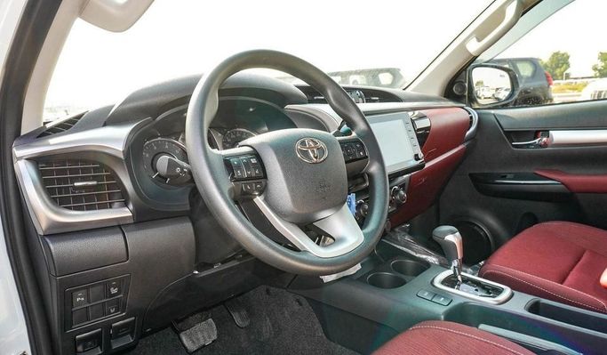 New Toyota Hilux VIII Facelift, 2.4 l, 2025 in Dubai by Najem Motors, White color. GCC Specs | AUTO.AE