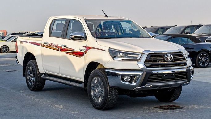 Новый Toyota Hilux VIII Рестайлинг, 2.7 л, 2025 в Дубае от Najem Motors Белый цвет. GCC | AUTO.AE