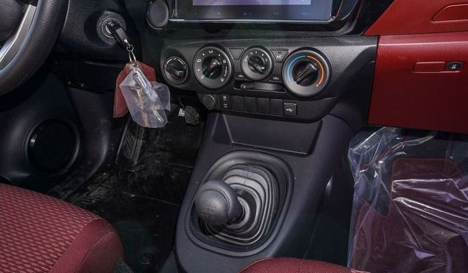 New Toyota Hilux Extra Cab VIII Facelift, 2.4 l, 2025 in Dubai by Najem Motors, White color. GCC Specs | AUTO.AE