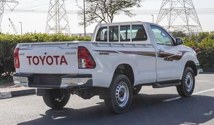New Toyota Hilux Extra Cab VIII Facelift, 2.4 l, 2025 in Dubai by Najem Motors, White color. GCC Specs | AUTO.AE
