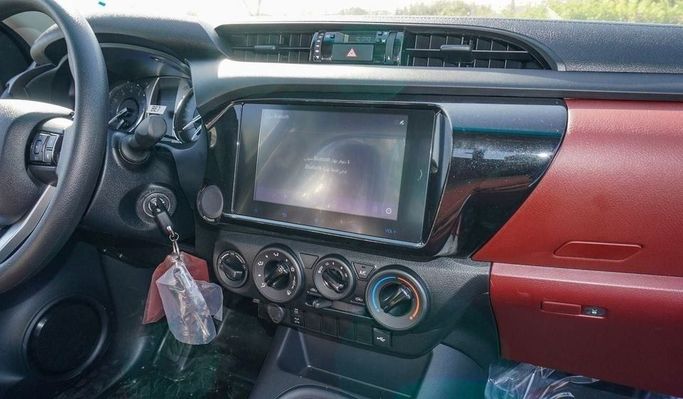 New Toyota Hilux Extra Cab VIII Facelift, 2.4 l, 2025 in Dubai by Najem Motors, White color. GCC Specs | AUTO.AE