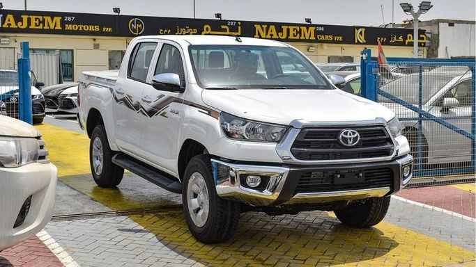 New Toyota Hilux VIII Facelift, 2.4 l, 2024 in Dubai by Najem Motors, White color. GCC Specs | AUTO.AE