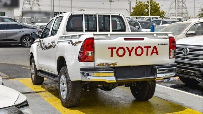 New Toyota Hilux VIII Facelift, 2.4 l, 2024 in Dubai by Najem Motors, White color. GCC Specs | AUTO.AE