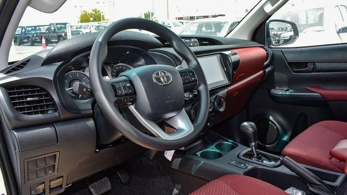 New Toyota Hilux VIII Facelift, 2.4 l, 2024 in Dubai by Najem Motors, White color. GCC Specs | AUTO.AE