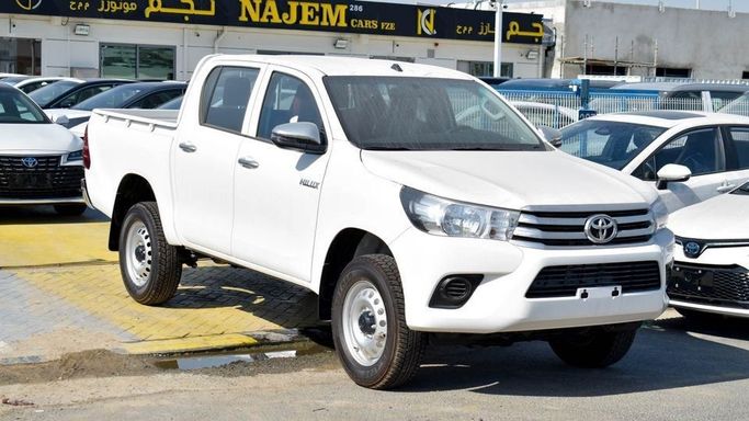 New Toyota Hilux VIII Facelift, 2.4 l, 2024 in Dubai by Najem Motors, White color. GCC Specs | AUTO.AE