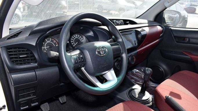 New Toyota Hilux VIII Facelift, 2.4 l, 2024 in Dubai by Najem Motors, White color. GCC Specs | AUTO.AE