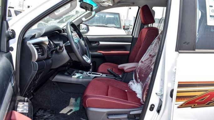 New Toyota Hilux VIII Facelift, 4.0 l, 2024 in Dubai by Najem Motors, White color. GCC Specs | AUTO.AE