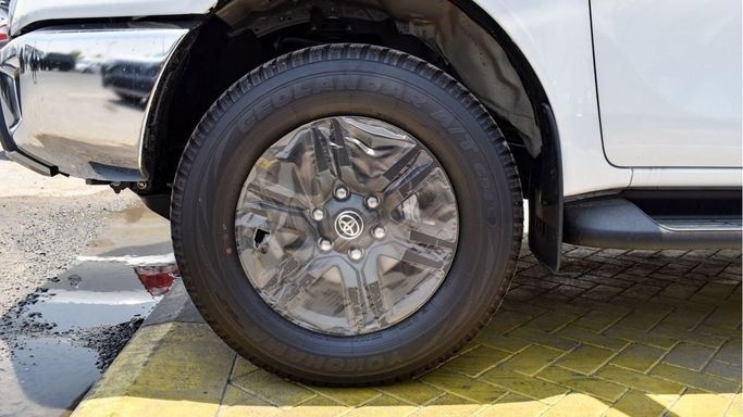 New Toyota Hilux VIII Facelift, 4.0 l, 2024 in Dubai by Najem Motors, White color. GCC Specs | AUTO.AE