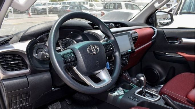 New Toyota Hilux VIII Facelift, 4.0 l, 2024 in Dubai by Najem Motors, White color. GCC Specs | AUTO.AE