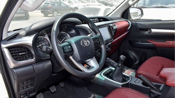 New Toyota Hilux VIII Facelift, 2.7 l, 2024 in Dubai by Najem Motors, White color. GCC Specs | AUTO.AE