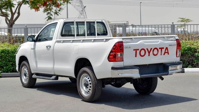 New Toyota Hilux Extra Cab VIII Facelift, 2.8 l, 2024 in Dubai by Najem Motors, White color. GCC Specs | AUTO.AE