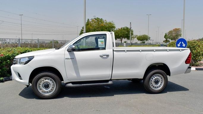 New Toyota Hilux Extra Cab VIII Facelift, 2.8 l, 2024 in Dubai by Najem Motors, White color. GCC Specs | AUTO.AE