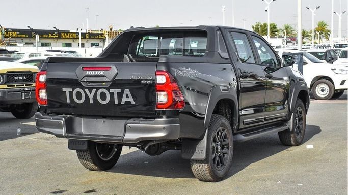 New Toyota Hilux VIII Facelift, 4.0 l, 2024 in Dubai by Najem Motors, Black color. GCC Specs | AUTO.AE