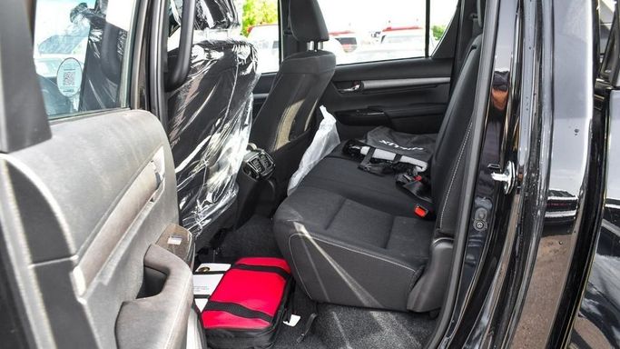 New Toyota Hilux VIII Facelift, 4.0 l, 2024 in Dubai by Najem Motors, Black color. GCC Specs | AUTO.AE