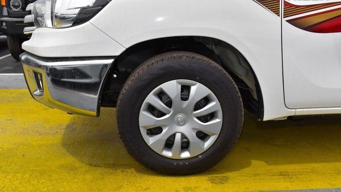 New Toyota Hilux Extra Cab VIII Facelift, 2.8 l, 2024 in Dubai by Najem Motors, White color. GCC Specs | AUTO.AE