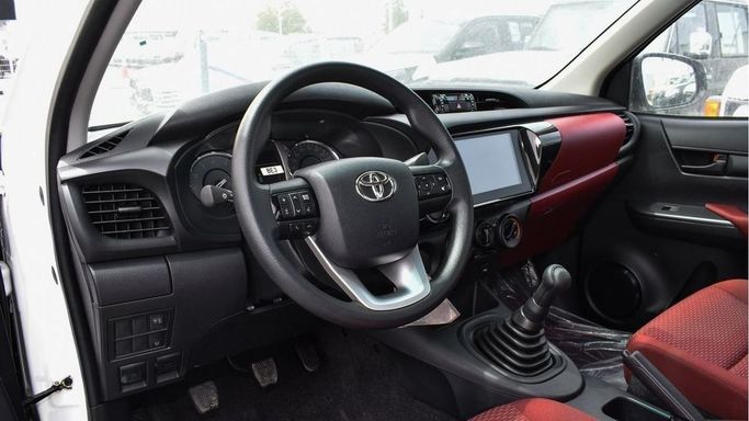 New Toyota Hilux Extra Cab VIII Facelift, 2.8 l, 2024 in Dubai by Najem Motors, White color. GCC Specs | AUTO.AE