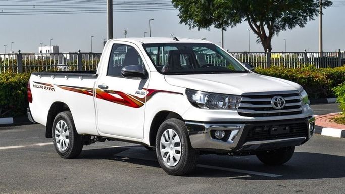 New Toyota Hilux Extra Cab VIII Facelift, 2.4 l, 2024 in Dubai by Najem Motors, White color. GCC Specs | AUTO.AE