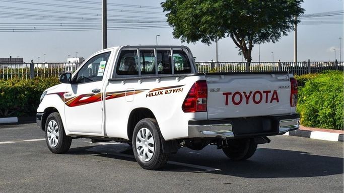 New Toyota Hilux Extra Cab VIII Facelift, 2.4 l, 2024 in Dubai by Najem Motors, White color. GCC Specs | AUTO.AE