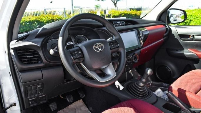 New Toyota Hilux Extra Cab VIII Facelift, 2.4 l, 2024 in Dubai by Najem Motors, White color. GCC Specs | AUTO.AE