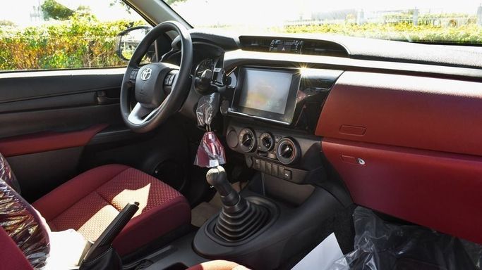 New Toyota Hilux Extra Cab VIII Facelift, 2.4 l, 2024 in Dubai by Najem Motors, White color. GCC Specs | AUTO.AE