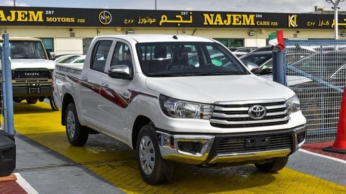 New Toyota Hilux VIII Facelift, 2.7 l, 2024 in Dubai by Najem Motors, White color. GCC Specs | AUTO.AE